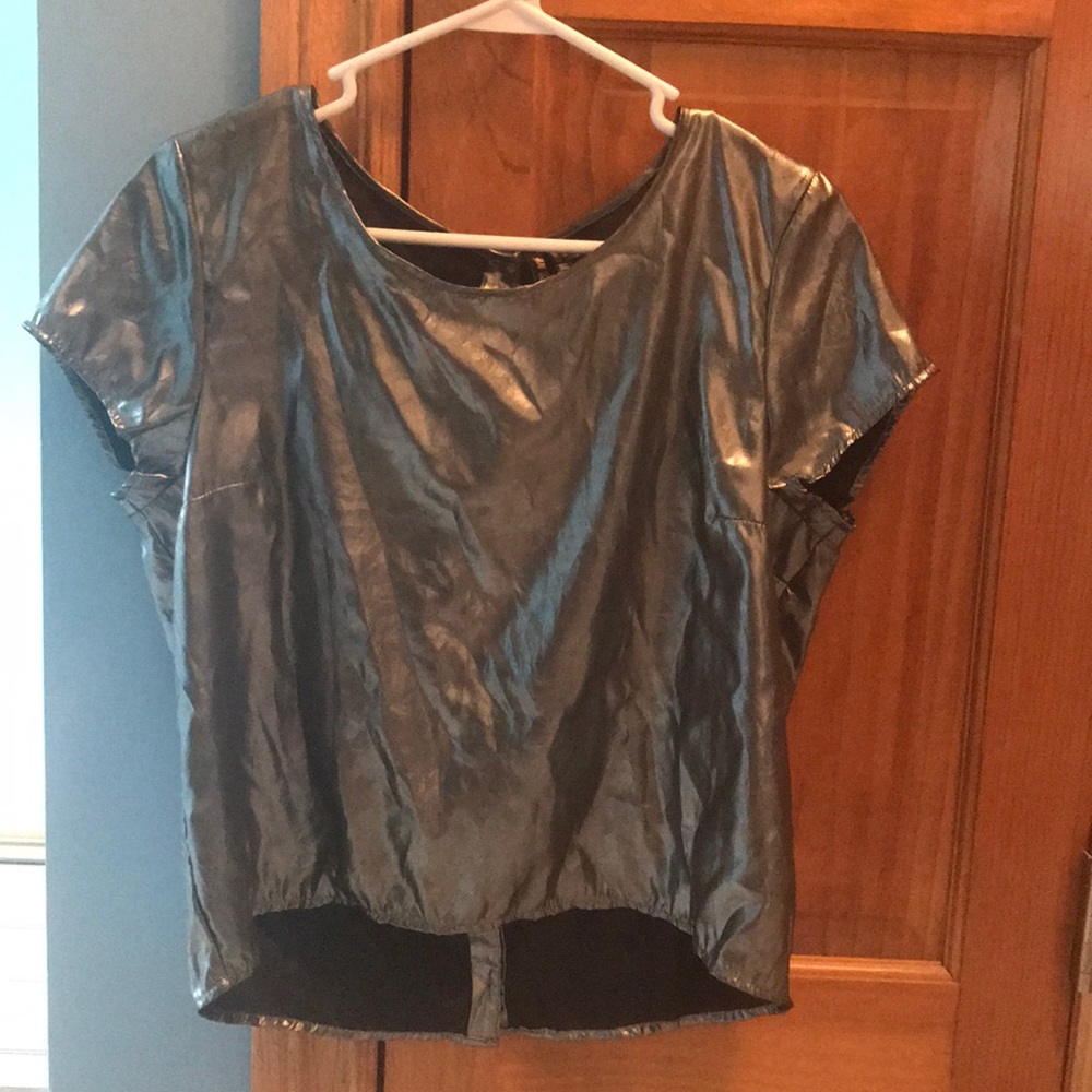 Silver blouse. Front solid back buttons